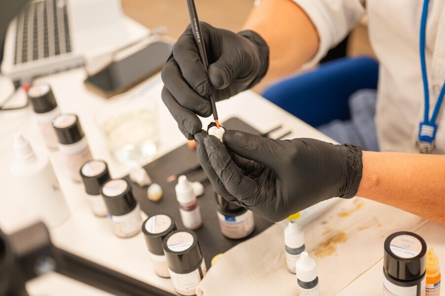 A company expert demonstrates some of the latest product innovations at Amann Girrbach.