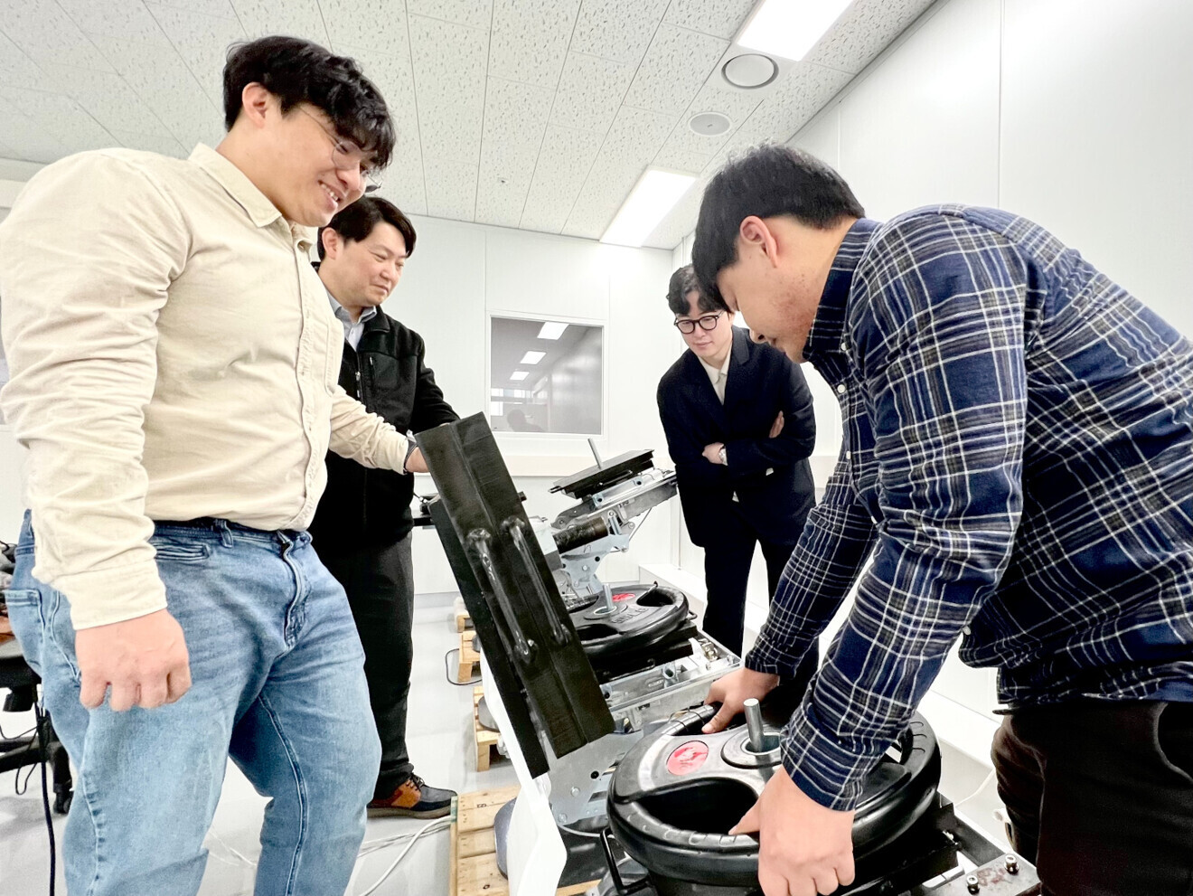 Researchers at Osstem Implant’s dental chair unit research and development centre conducting a load test.