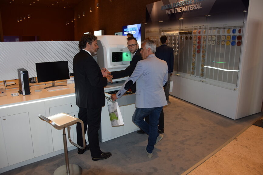 Attendess inspecting Ivoclar Vivadent's products