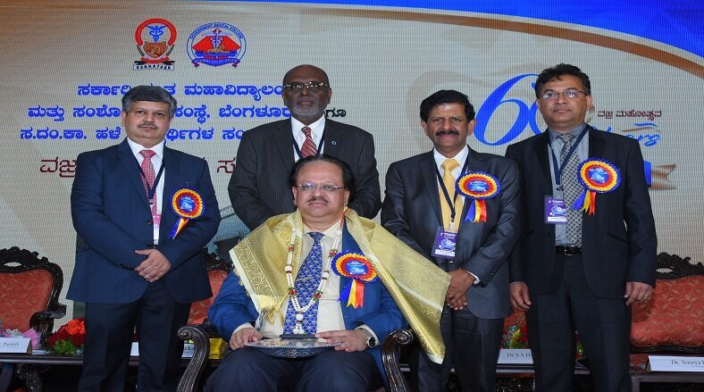 Felicitation of Dr S Sacchidanand (seated), Hon’ble Vice Chancellor,RGUHS by Organising Committee of GDCRI Diamond Jubilee Celebrations 
