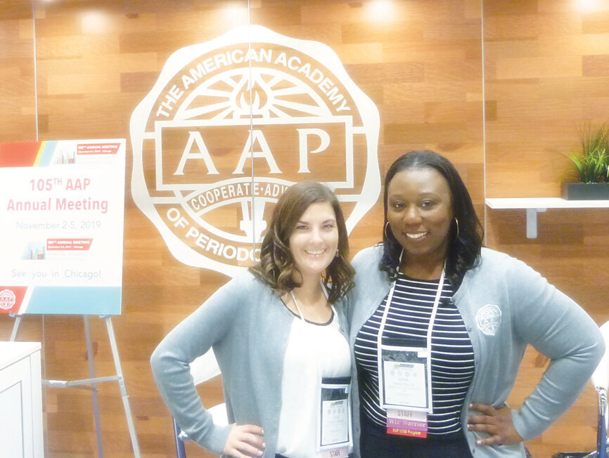 Julie Flanigan, left, AAP marketing and digital communications manager, and Mame Kwayie, AAP’s public relations manager, at the AAP Membership booth. (Photo: Sierra Rendon/DTA)