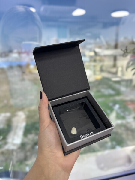 Patented delivery box used at DentLab to prevent loss of items.