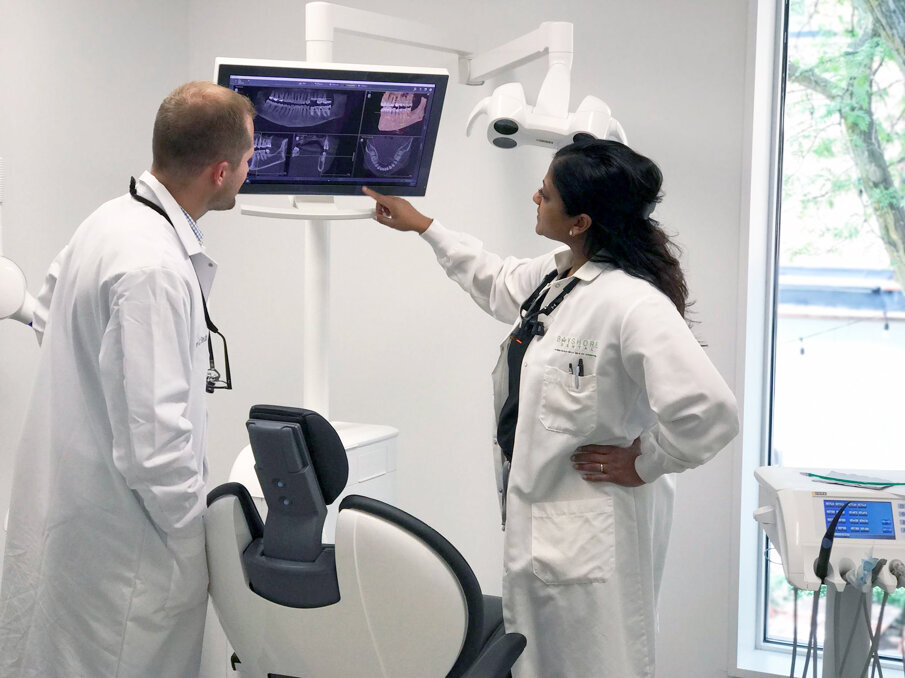 Dr. Patel and Dr. Seubert consult on a case. (Photograph: Dentsply Sirona)