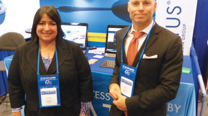 Trisha Carlin and Jason Whitmore stand ready to help at the Ceatus Media Group booth. Photo by Sierra Rendon/DTA