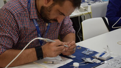 A ROOTS SUMMIT attendee enjoying the hands-on learning.