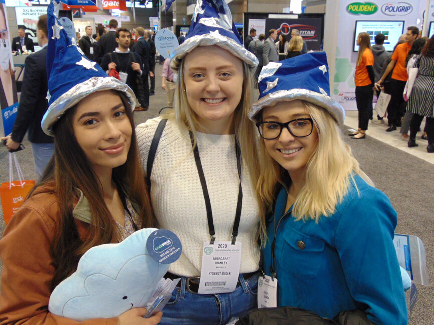 These hygiene students sure have learned how to make their first Midwinter Meeting lots of fun. From left: Lizbeth Zacarias, Margaret Hanley and Kelly L. O’Brien.