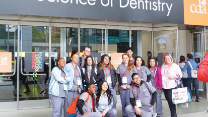 ADHP dental students pause for a commemorative group photo before heading into CDA Presents at Moscone South in San Francisco. (Photo: Sierra Rendon, DTA)