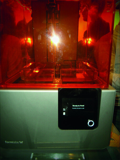 Fig. 20b: SLA 3D printers presented at the 2017 IDS: XFAB printer (a) and Formlabs’ Form 2 printer (b).