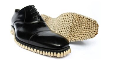 Artist duo designs shoes with teeth sole