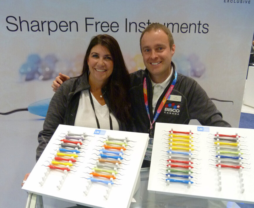 Kathleen Bokrossy and Anssi Dumontier display a colorful selection of instruments in the Bisco booth. (Photo: Robert Selleck/Dental Tribune)