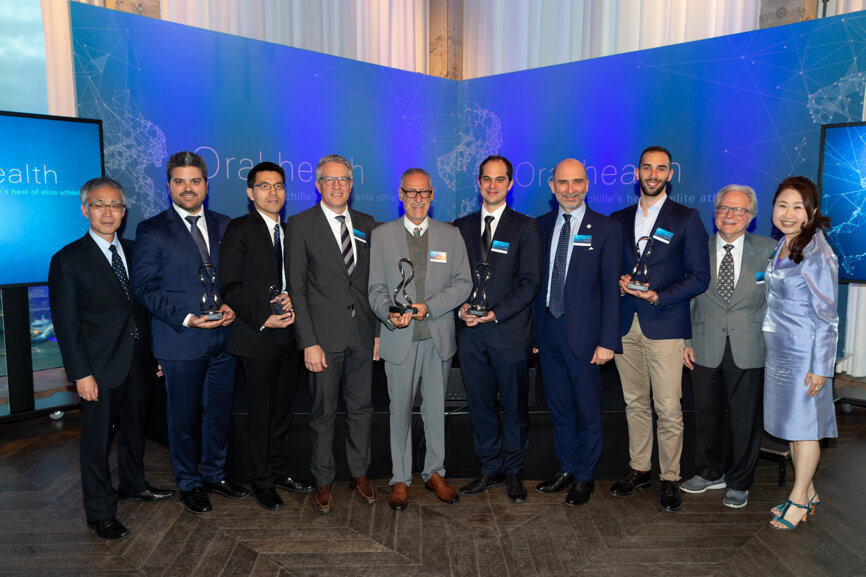 The winners of the Perio Link Award and World Perio Research Awards with the award presenters.