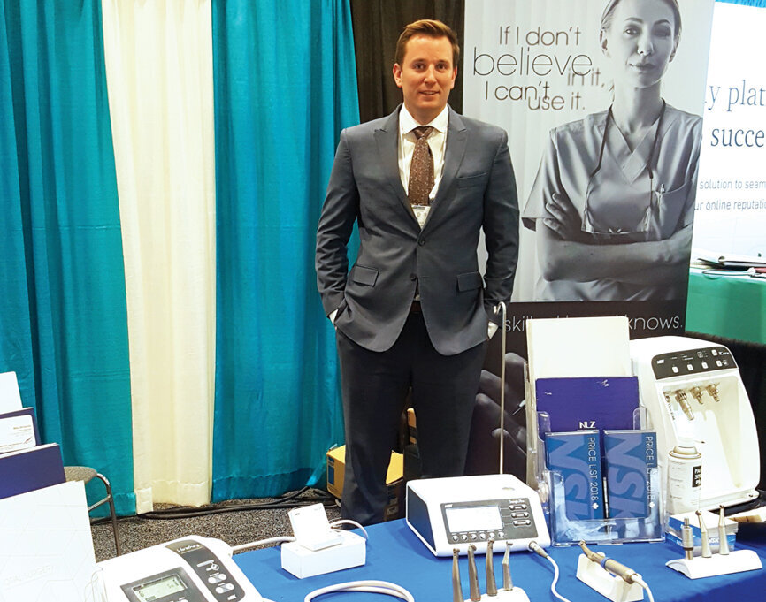 Mike Birtwistle of NSK stands ready to offer attendees all the newest technology. (Photo: Leerol Colquhoun/DTA)