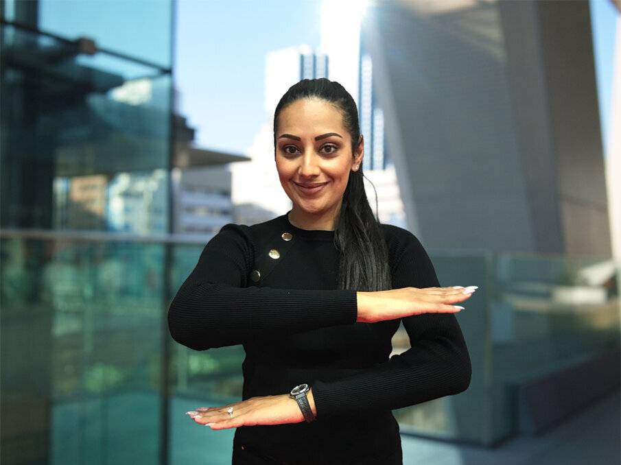 Dentsply Sirona employee, Harpreet Atwal showing the motto of this year’s International Women’s Day #EachforEqual