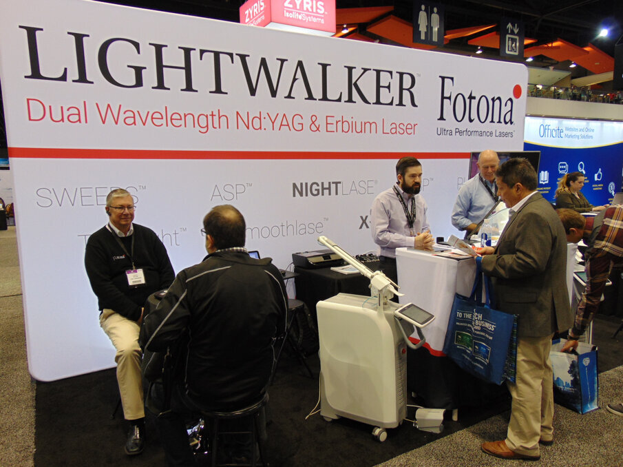 Meeting attendees visit with the reps at Fotona to learn about the Lightwalker dual-wavelength laser. (Photo: Fred Michmershuizen/Dental Tribune America)
