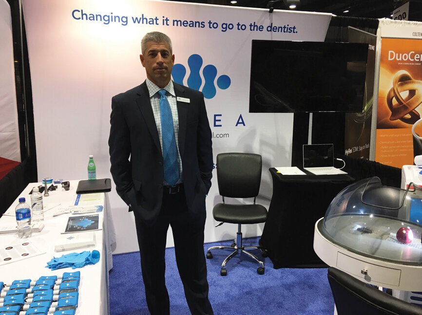 Michael Porro in the Convergent Dental booth.