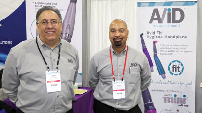 At the Avid booth, President and CEO Chris Carron, left, and Ellis Bentley Jr. are happy to tell you all about the new Avid Premiere Hygiene Handpiece.