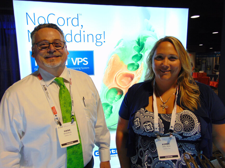 Hank Buddrus, left, and Aimee Vail, RDH, of Centrix. 