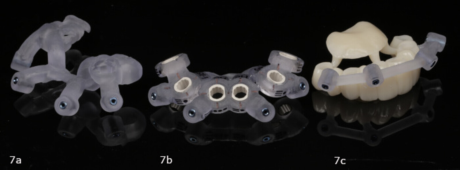 Figs. 7a–c: Anchor pin guide (a). Implant surgical guide (b). Provisional prosthesis (c).