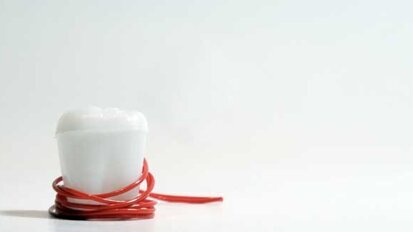 Survey: Tooth fairy is tightening her purse strings