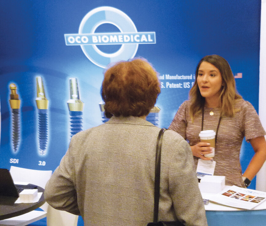 Learning more about OCO Biomedical complete implant solutions. Photo by Sierra Rendon/DTA