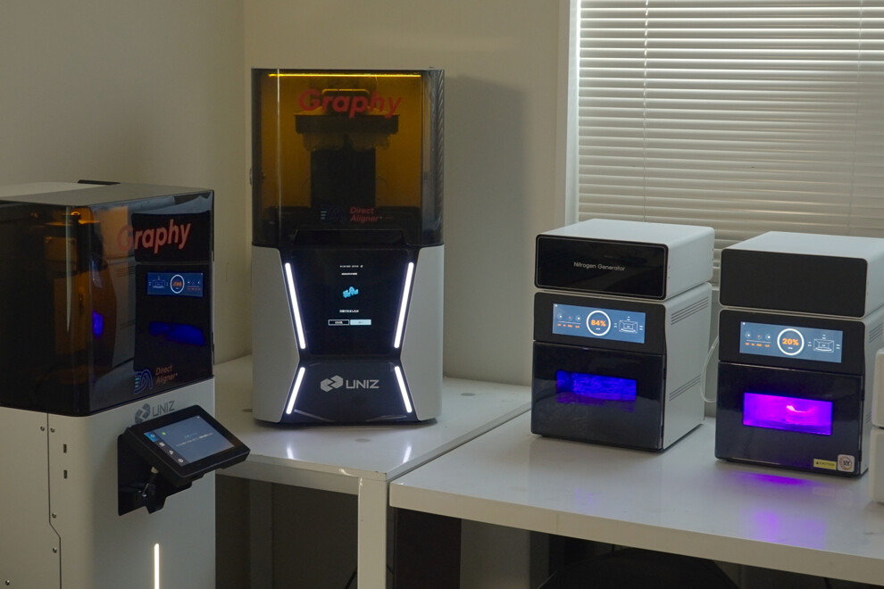 Fig. 7: UBEE 3D printer and Tera Harz Cure post-polymerisation unit used in the Shape Memory Aligner workflow.