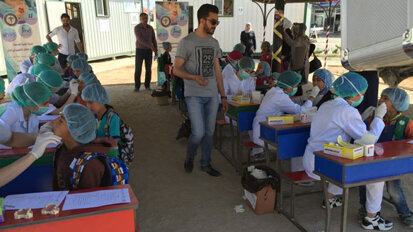 Dental professor travels to Syrian refugee camps, treats more than 1,000 children