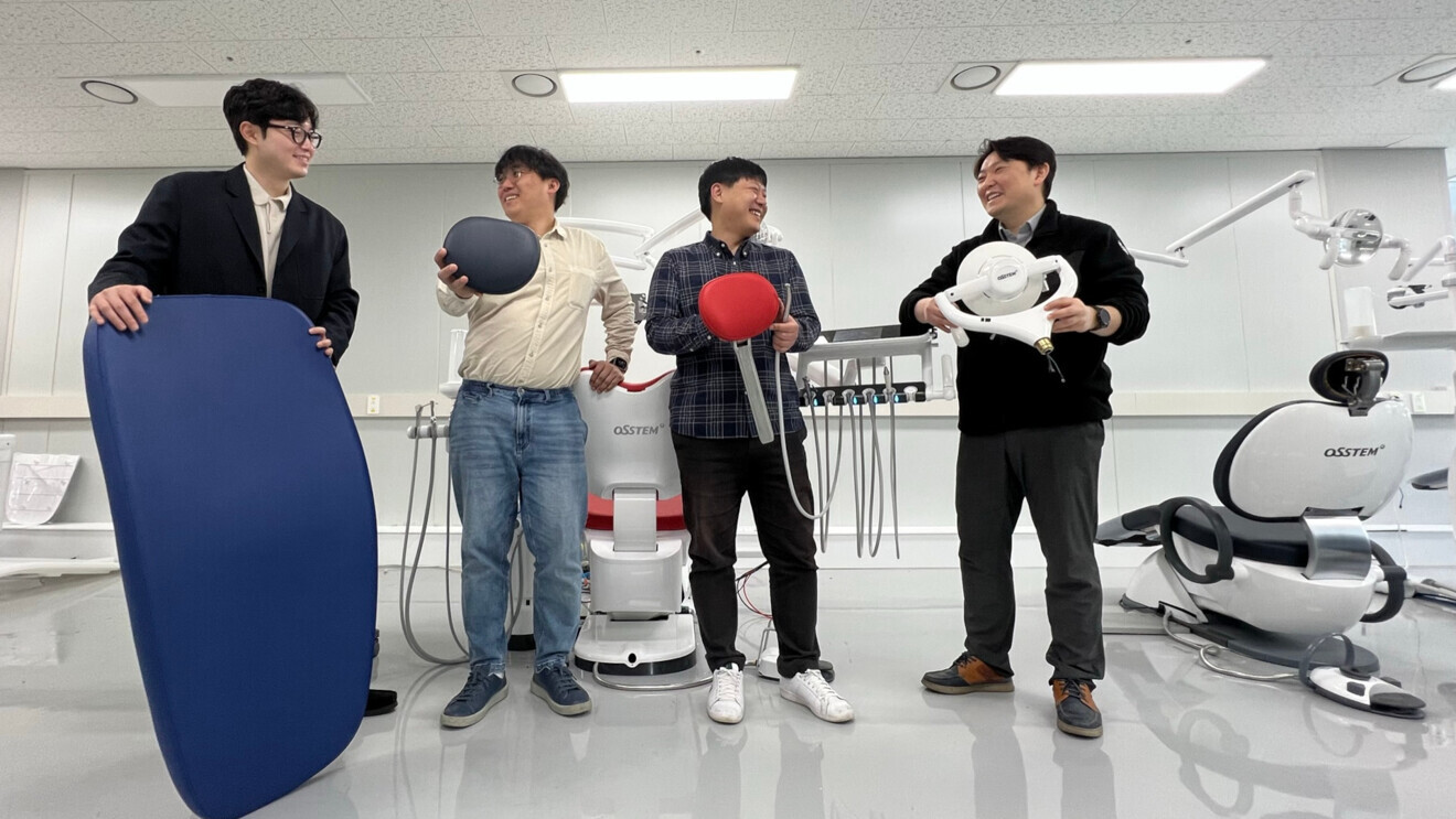 Researchers at the dental chair unit research division in Osstem Implant's central research centre in South Korea showcase the hardware they developed.