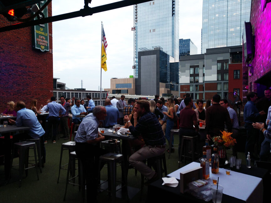 Attendees meet for a beverage and a bite at AAOMS.