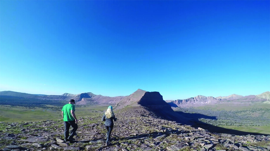 Brown and Loyola hunt for the VALO Grand light on a mountain of loose shale.