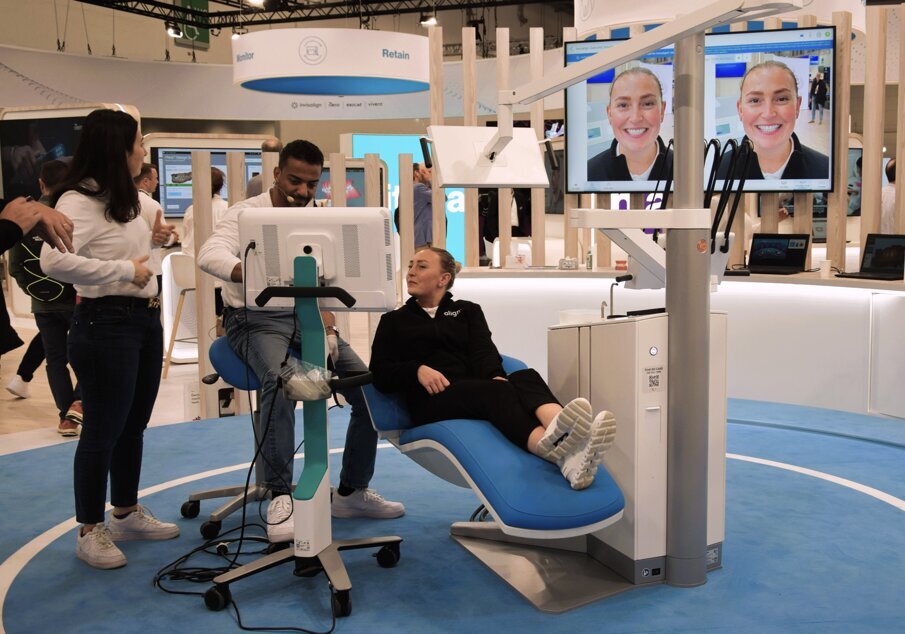 Treatment outcome simulation at the Align Technology booth.
