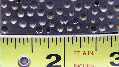 Metal foam takes stress off dental implants