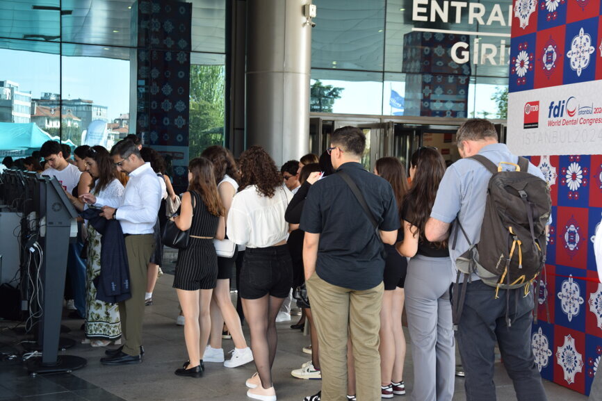 Participants checking in for the 2024 FDI World Dental Congress.
