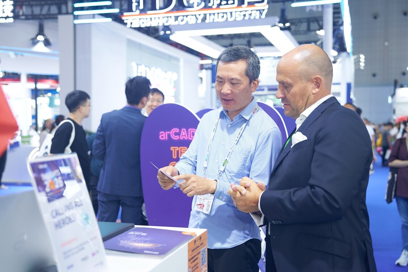 At the exocad booth, DTI representatives learned more about the event, which will be held under the theme “Calling all heroes.”
