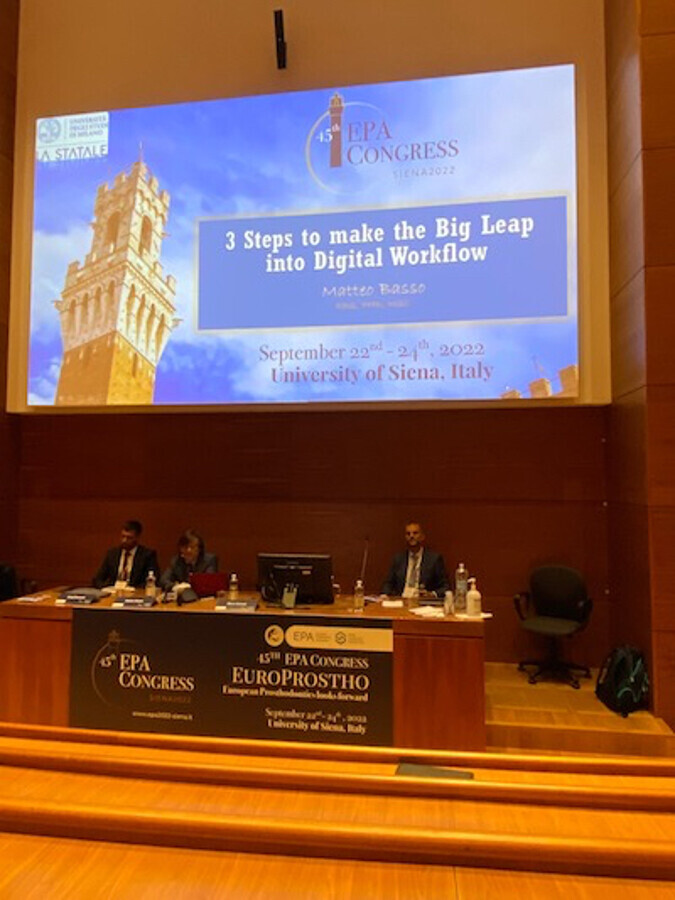 image of three dentists sitting at a congress