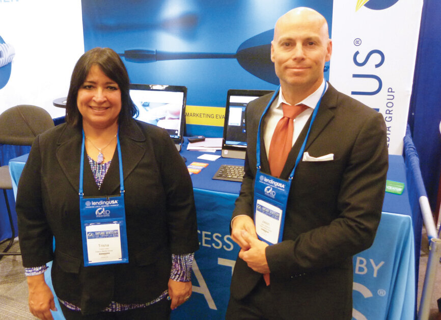 Trisha Carlin and Jason Whitmore stand ready to help at the Ceatus Media Group booth. Photo by Sierra Rendon/DTA
