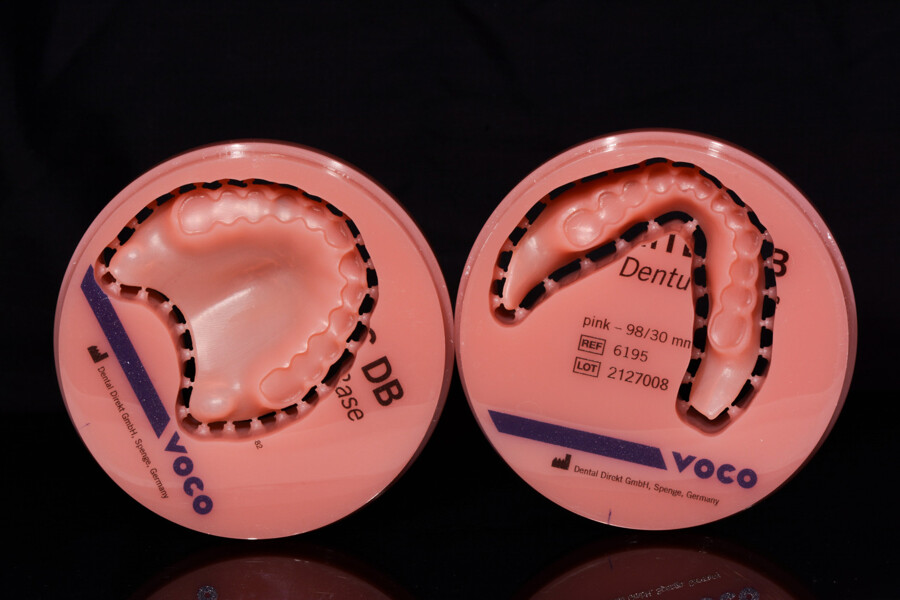 Fig. 18: Milled denture bases connected to the blank via connectors.
