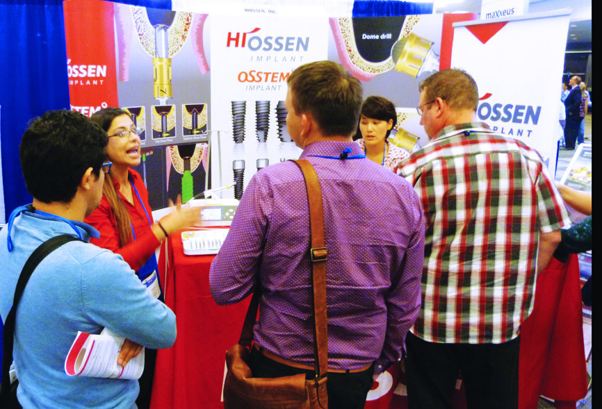 Alisha Loya of Hiossen tells attendees about the Hiossen Implant System. Photo by Sierra Rendon/DTA