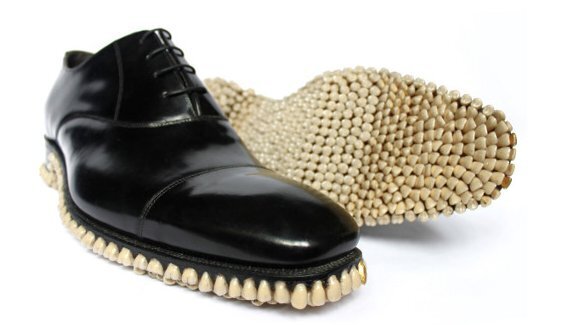 Artist duo designs shoes with teeth sole