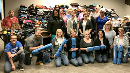 Dentsply Sirona Endodontics employees prepare to deliver donations to Youth Services Tulsa