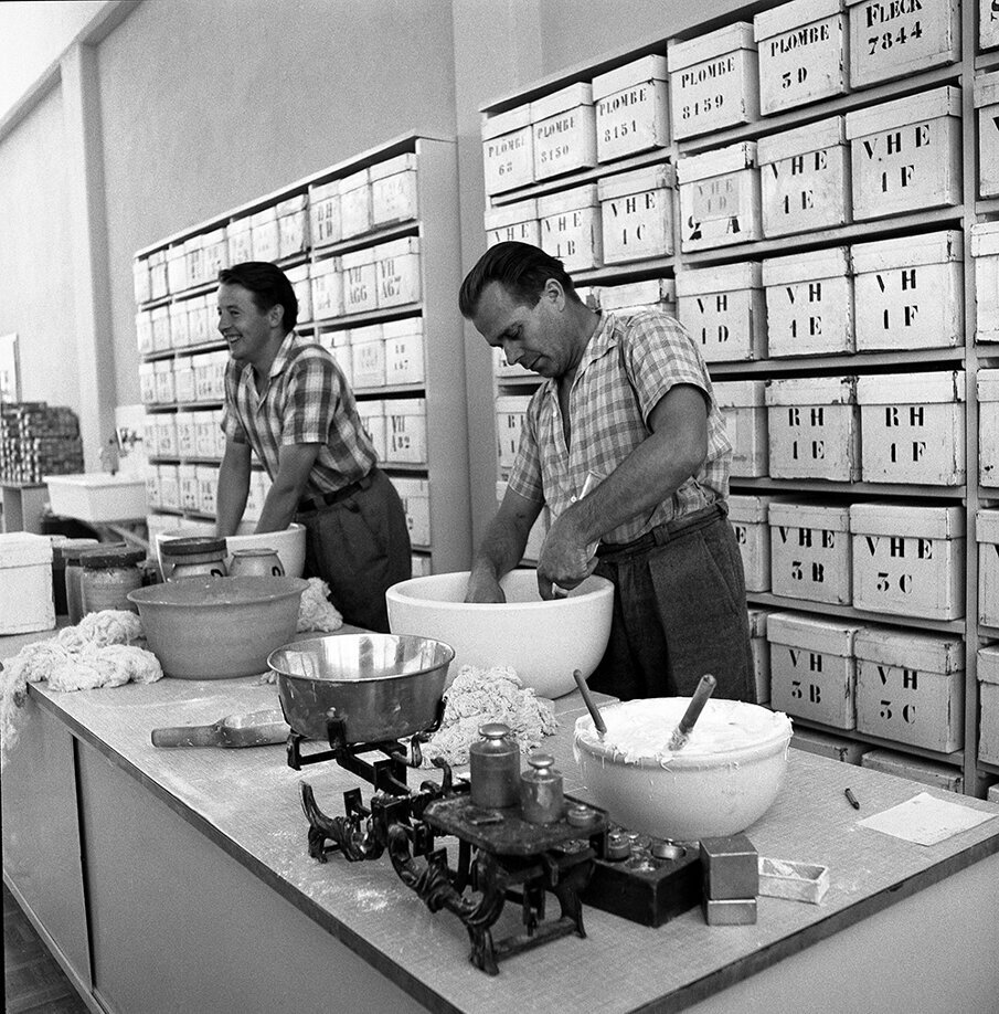 Employees in the 1950s mixing together various raw materials for the production of acrylic teeth.