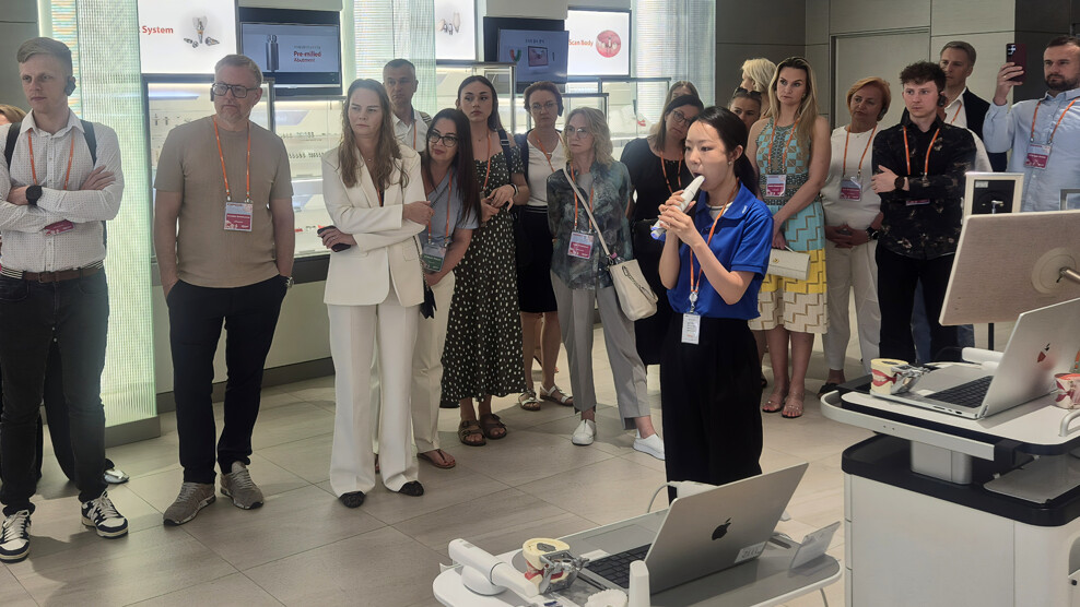 Clinicians observe an intra-oral scanner demonstration at Osstem Implant’s headquarters in South Korea.